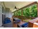 Inviting covered porch with comfortable wicker furniture and a ceiling fan, perfect for relaxing at 30 Hollyhock Ln, Covington, GA 30014