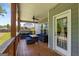 Inviting back porch with comfortable wicker furniture, a ceiling fan, and access to the backyard at 30 Hollyhock Ln, Covington, GA 30014