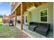 Backyard patio with outdoor seating area, grill, and a grassy area, perfect for entertaining at 30 Hollyhock Ln, Covington, GA 30014