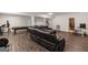 Spacious finished basement has multiple entertaining areas with a billiard table and comfortable seating at 30 Hollyhock Ln, Covington, GA 30014