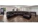 Finished basement with a large sectional sofa, entertainment area, and natural light from windows at 30 Hollyhock Ln, Covington, GA 30014