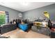 Fun bedroom features a whimsical cityscape mural, a large fish tank, and Batman-themed accents at 30 Hollyhock Ln, Covington, GA 30014