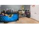 Whimsical bedroom featuring a Batman theme, including a large fish tank and a custom city-scape wall mural at 30 Hollyhock Ln, Covington, GA 30014