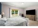Bright bedroom with neutral colors, large window, and ample space for relaxation and restful retreat at 30 Hollyhock Ln, Covington, GA 30014