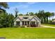 Well-manicured lawn and stone accents complement the charming craftsman-style home at 30 Hollyhock Ln, Covington, GA 30014
