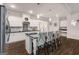 Modern open-concept kitchen featuring a center island with bar seating and stainless appliances at 30 Hollyhock Ln, Covington, GA 30014