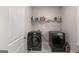 Practical laundry room with black washer and dryer units at 30 Hollyhock Ln, Covington, GA 30014