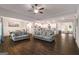 Spacious open-concept living area with hardwood floors and a view of the kitchen at 30 Hollyhock Ln, Covington, GA 30014
