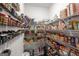 Organized walk-in pantry featuring rows of shelving filled with various food items and kitchen supplies at 30 Hollyhock Ln, Covington, GA 30014
