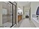 Bright bathroom featuring a large glass shower, granite countertop vanity, and access to the soaking tub at 45 Coral Ridge Ct, Palmetto, GA 30268