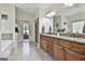 Bright bathroom featuring a double sink vanity with granite countertops, soaking tub, and large shower at 45 Coral Ridge Ct, Palmetto, GA 30268
