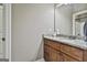 Bathroom with granite countertop vanity, wooden cabinets, and a neutral color palette at 45 Coral Ridge Ct, Palmetto, GA 30268