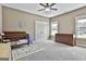 Bedroom featuring a crib, a rug, a dresser, and double doors at 45 Coral Ridge Ct, Palmetto, GA 30268