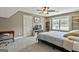 Bedroom with neutral color palette, a bed, a desk, and built in shelves at 45 Coral Ridge Ct, Palmetto, GA 30268