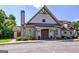 Exterior of the community clubhouse, featuring a gabled roof, stone accents, and well-maintained landscaping at 45 Coral Ridge Ct, Palmetto, GA 30268