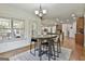 The dining area features hardwood floors and a view of the outdoor patio through the window at 45 Coral Ridge Ct, Palmetto, GA 30268