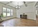 Bright dining room featuring hardwood floors, coffered ceilings, and a large window at 45 Coral Ridge Ct, Palmetto, GA 30268