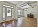 Bright dining room featuring hardwood floors, coffered ceilings, and large windows at 45 Coral Ridge Ct, Palmetto, GA 30268