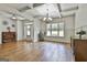 Elegant dining room featuring hardwood floors, coffered ceilings, and a stylish chandelier at 45 Coral Ridge Ct, Palmetto, GA 30268