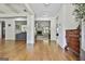 Inviting entryway showcasing gleaming hardwood floors, decorative columns, and stylish console table at 45 Coral Ridge Ct, Palmetto, GA 30268