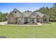 Charming craftsman-style home with stone accents, lush landscaping, and inviting entrance at 45 Coral Ridge Ct, Palmetto, GA 30268