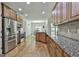 Open kitchen and dining area layout with granite countertops and stainless steel appliances at 45 Coral Ridge Ct, Palmetto, GA 30268