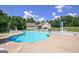Community pool featuring lounge chairs, umbrellas, and a separate shallow area for enjoyment at 45 Coral Ridge Ct, Palmetto, GA 30268