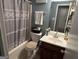 Bathroom with a tub-shower combination and a dark wood vanity, offering a functional space at 435 Rosehill Dr, Mcdonough, GA 30253