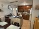 Functional kitchen featuring a breakfast bar and cherry wood cabinets, perfect for casual dining at 435 Rosehill Dr, Mcdonough, GA 30253