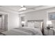 Comfortable bedroom with a ceiling fan and ample natural light, featuring cozy bedding at 1208 Trombone Way # 106, Mcdonough, GA 30252