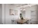 Elegant dining room featuring a modern chandelier and ample seating for gatherings at 1208 Trombone Way # 106, Mcdonough, GA 30252