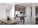 Elegant kitchen with wooden cabinets, stainless steel appliances, and a dining area at 1208 Trombone Way # 106, Mcdonough, GA 30252