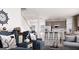 Spacious living room with modern kitchen view, comfortable seating, and natural light at 1208 Trombone Way # 106, Mcdonough, GA 30252
