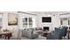 Comfortable living room featuring a fireplace, large windows, and stylish decor at 1208 Trombone Way # 106, Mcdonough, GA 30252