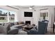 Bright living room showcasing a fireplace, modern furniture, and ample natural light at 1208 Trombone Way # 106, Mcdonough, GA 30252