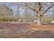 Large backyard features mature trees and foliage, creating a serene outdoor space at 435 Crabapple Rd, Fayetteville, GA 30215
