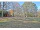 Backyard featuring a playhouse and play structure creating an adventurous space for children at 435 Crabapple Rd, Fayetteville, GA 30215