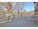 Backyard deck with white railing, outdoor seating, and treed views at 435 Crabapple Rd, Fayetteville, GA 30215