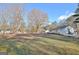 Spacious backyard with mature trees and ample room for outdoor activities and relaxation at 435 Crabapple Rd, Fayetteville, GA 30215