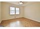 Bright bedroom featuring a window with view, parquet floors and a ceiling fan at 435 Crabapple Rd, Fayetteville, GA 30215