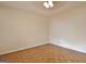 Bright bedroom with parquet flooring, neutral walls and ceiling fan with lighting at 435 Crabapple Rd, Fayetteville, GA 30215