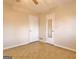 Bedroom with parquet flooring, neutral walls, ceiling fan and two doors at 435 Crabapple Rd, Fayetteville, GA 30215