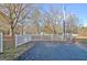 Long driveway leading to the property, surrounded by trees and a white picket fence at 435 Crabapple Rd, Fayetteville, GA 30215