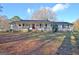 Charming home with a welcoming front porch and a beautiful lawn on a sunny day at 435 Crabapple Rd, Fayetteville, GA 30215