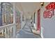 Covered porch, complete with rocking chairs and a charming red front door at 435 Crabapple Rd, Fayetteville, GA 30215