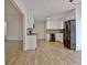 Bright kitchen featuring white cabinets and stainless steel appliances at 435 Crabapple Rd, Fayetteville, GA 30215