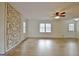 Sunlit living room with wood-style floors offers a comfortable space with great natural light at 435 Crabapple Rd, Fayetteville, GA 30215