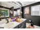 Modern black bathroom with large mirror and dual sinks at 422 Old Ivy Path, Mcdonough, GA 30253
