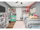 Quirky bedroom with gray walls, stuffed animals, and LED lights at 422 Old Ivy Path, Mcdonough, GA 30253