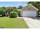 Charming single-story home with well-manicured lawn and attached two car garage at 422 Old Ivy Path, Mcdonough, GA 30253